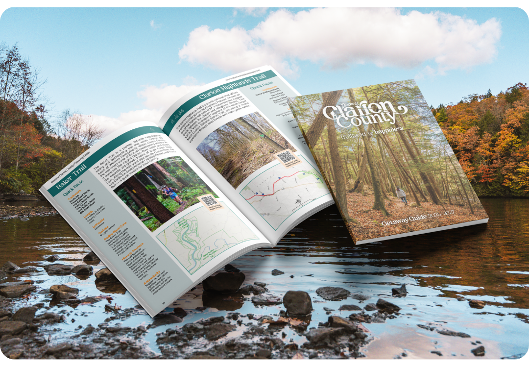 The Clarion River with a mockup of the Discover Clarion County Getaway Guide overtop